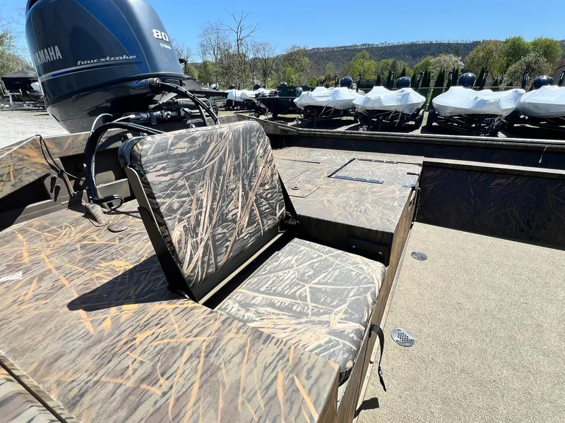 Slide: The Image of 2025 G3 Gator Tough 18 CCJ boat with Yamaha 80 engine, camo seating, and spacious deck. - 15