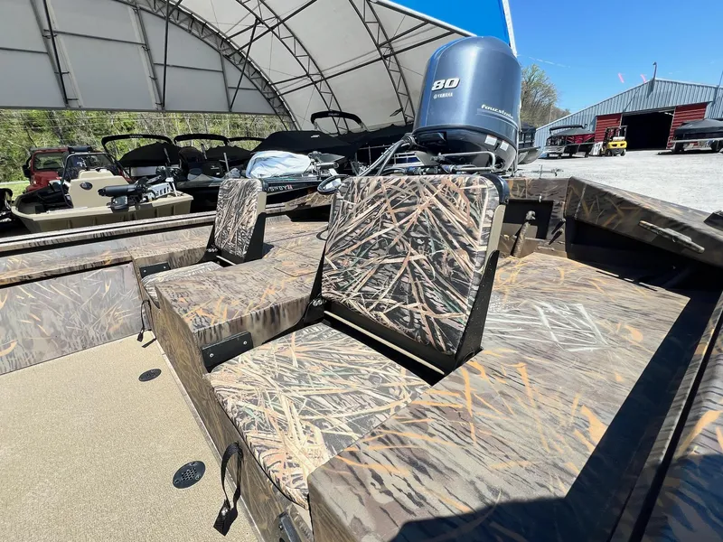 Slide: The Image of 2025 G3 Gator Tough 18 CCJ boat with camo seats and Yamaha engine. - 16