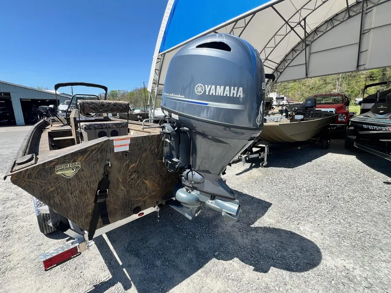 Slide: The Image of 2025 G3 Gator Tough 18 CCJ boat with Yamaha outboard motor, parked outdoors. - 17