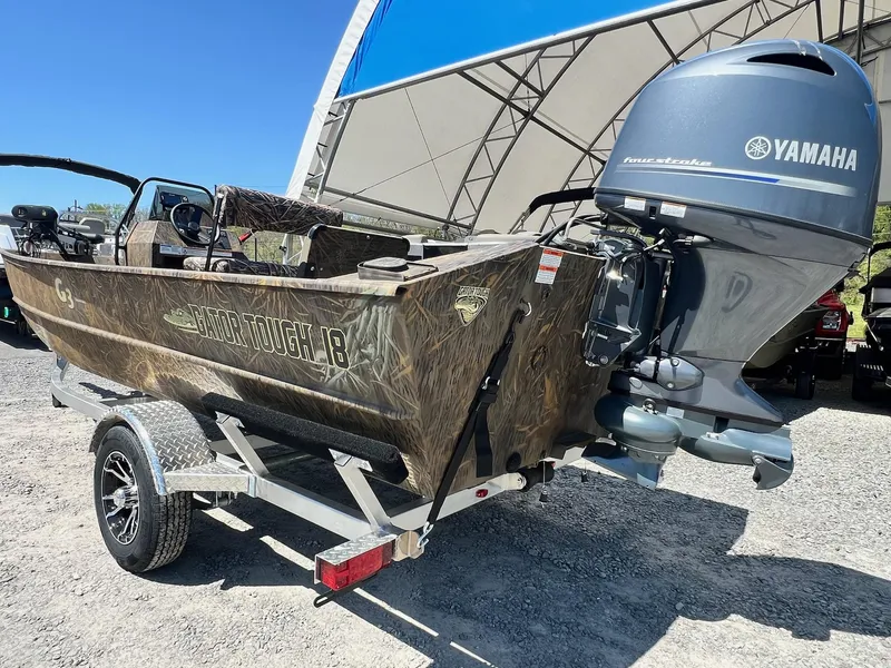 Slide: The Image of 2025 G3 Gator Tough 18 CCJ boat with Yamaha outboard engine on trailer. - 20