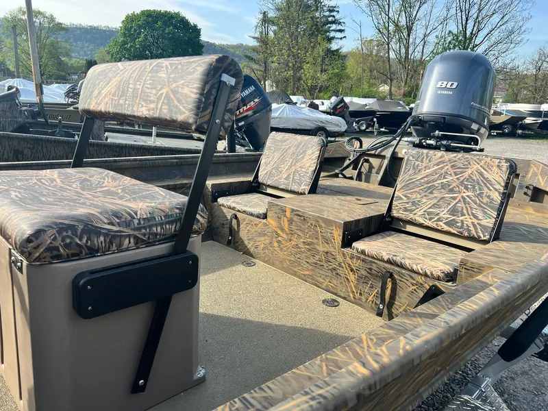 Slide: The Image of 2025 G3 Gator Tough 18 CCJ boat with camo seating and Yamaha 80 engine. - 21