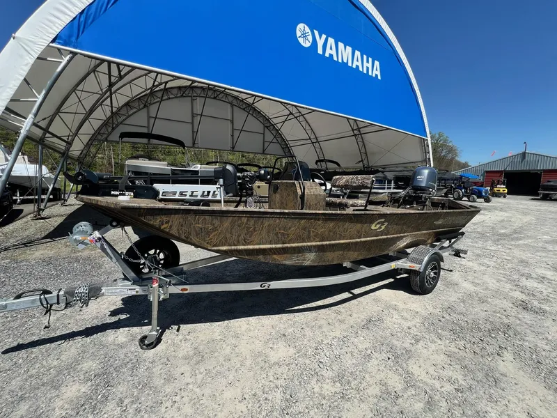 Slide: The Image of 2025 G3 Gator Tough 18 CCJ boat on trailer under Yamaha canopy. - 22