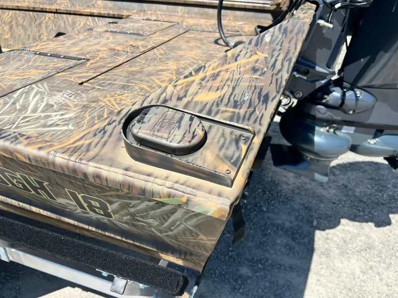 Slide: The Image of 2025 G3 Gator Tough 18 CCJ boat with camouflage design and motor detail. - 27