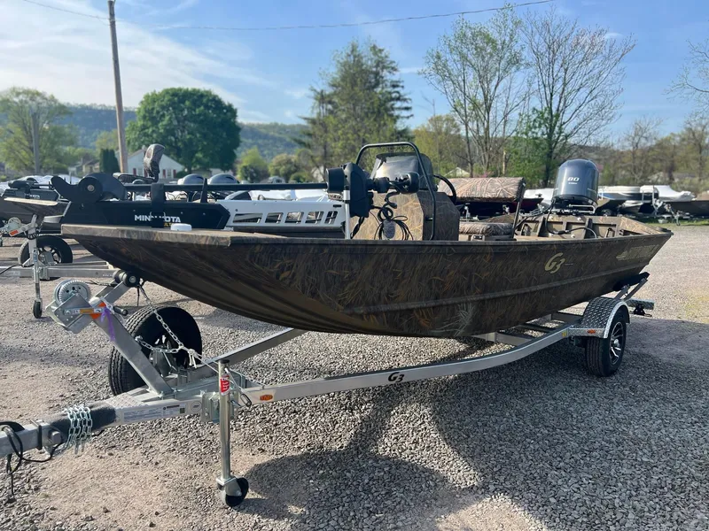 Slide: The Image of 2025 G3 Gator Tough 18 CCJ boat on trailer, parked outdoors. - 4