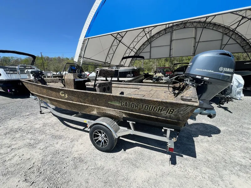 Slide: The Image of 2025 G3 Gator Tough 18 CCJ boat with Yamaha engine on trailer under canopy. - 9