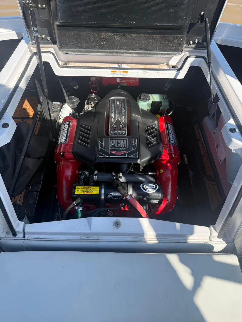 Slide: The Image of 2014 Nautique Super Air Nautique G21 engine compartment with PCM engine visible. - 11