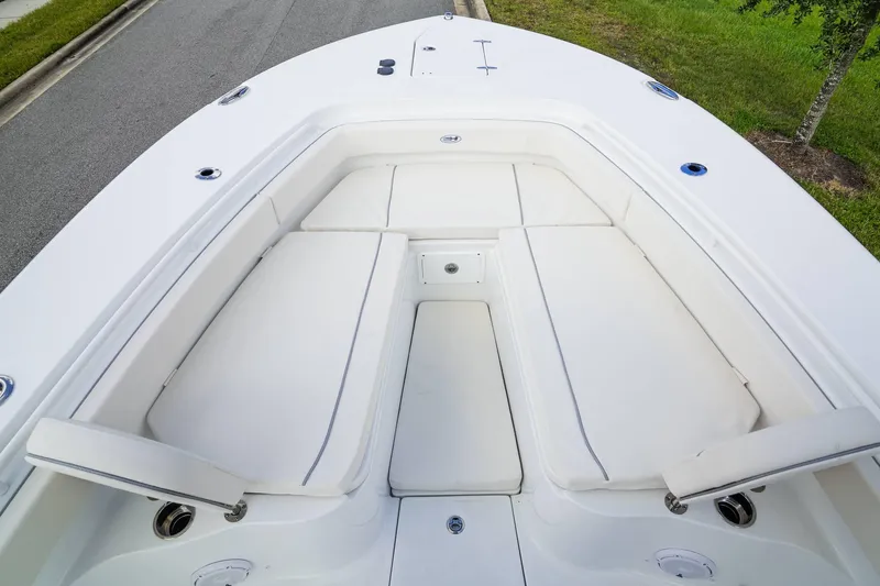 Slide: The Image of 2025 Sea Hunt Gamefish 28 FS boat with spacious white seating area. - 10