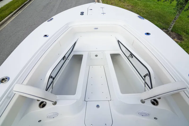 Slide: The Image of 2025 Sea Hunt Gamefish 28 FS boat interior with open storage compartments. - 12