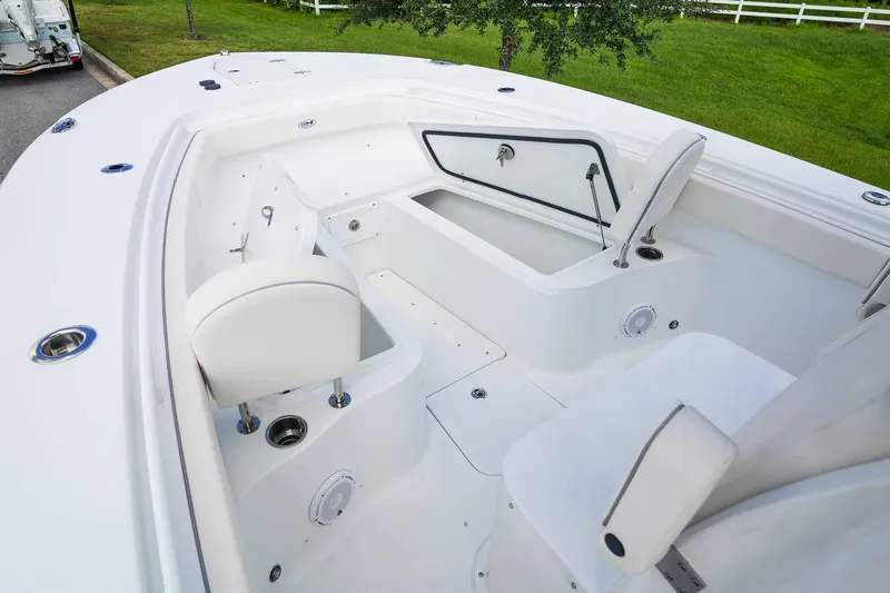 Slide: The Image of 2025 Sea Hunt Gamefish 28 FS boat interior with seating and storage compartments. - 13