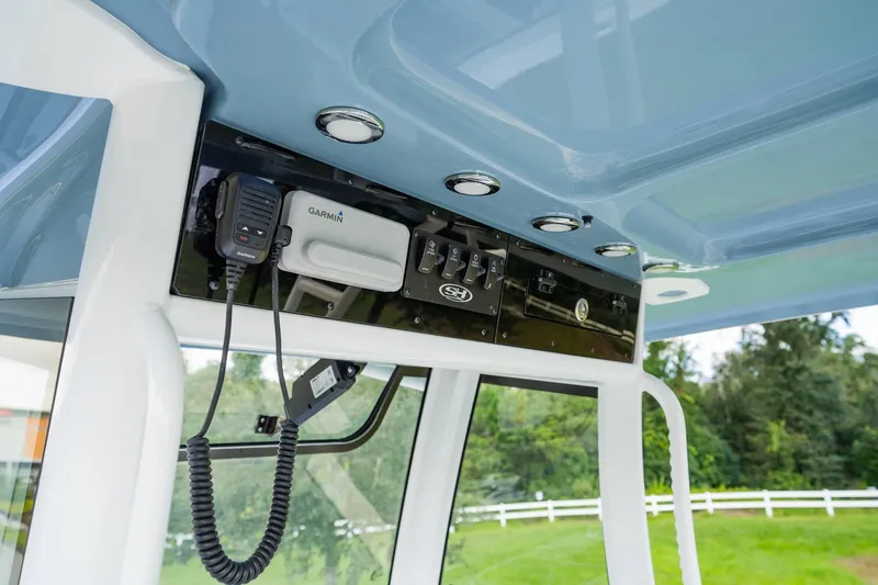 Slide: The Image of 2025 Sea Hunt Gamefish 28 FS boat console with Garmin electronics and controls. - 14