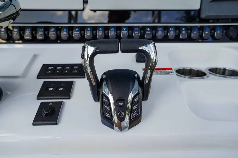 Slide: The Image of Control panel of 2025 Sea Hunt Gamefish 28 FS boat with throttle and switches. - 15