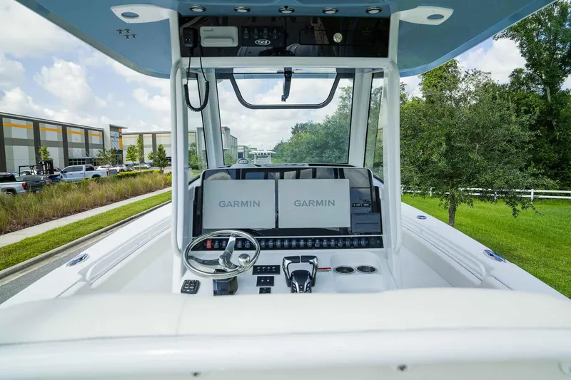 Slide: The Image of 2025 Sea Hunt Gamefish 28 FS boat dashboard with Garmin navigation system. - 20