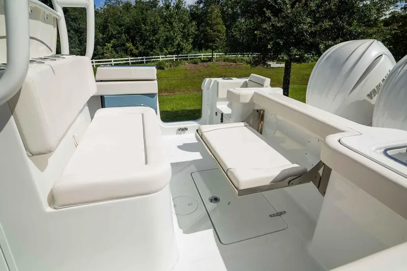 Slide: The Image of 2025 Sea Hunt Gamefish 28 FS boat interior with white seating and dual engines. - 23