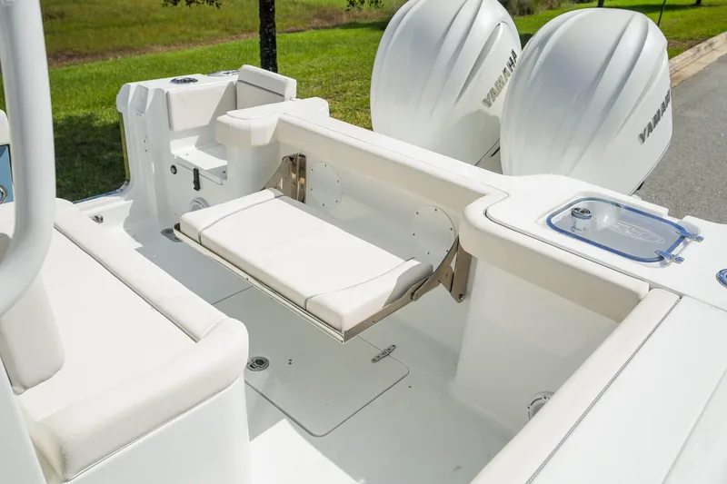 Slide: The Image of 2025 Sea Hunt Gamefish 28 FS boat interior with seating and dual Yamaha engines. - 25
