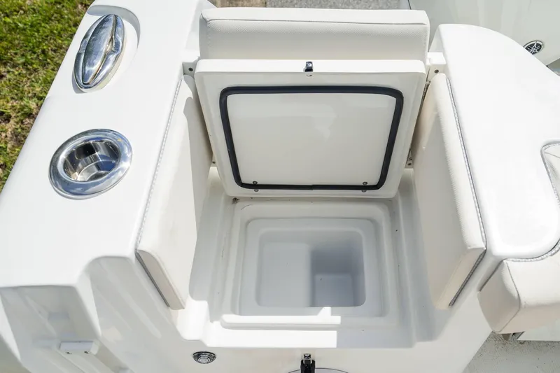 Slide: The Image of 2025 Sea Hunt Gamefish 28 FS boat storage compartment with cup holder. - 26
