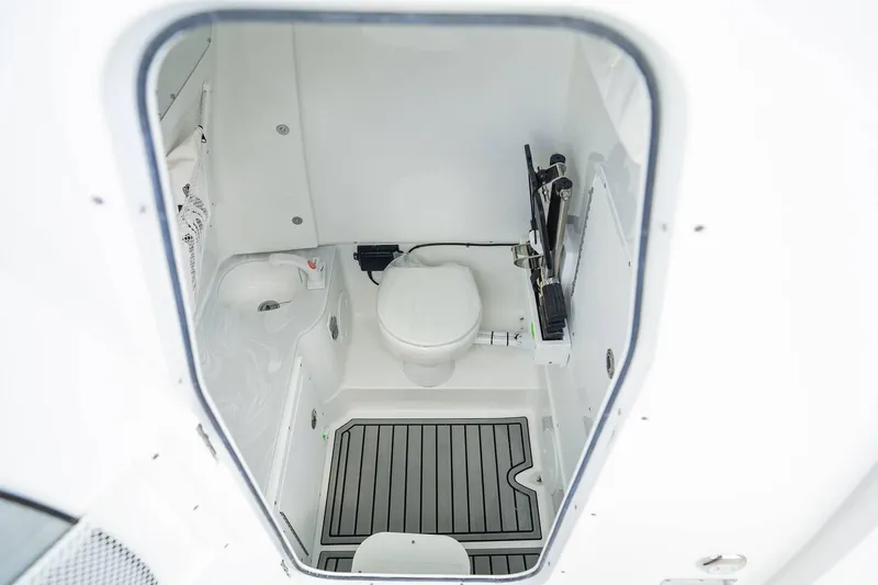 Slide: The Image of Interior of 2025 Sea Hunt Gamefish 28 FS boat bathroom with toilet and flooring. - 6