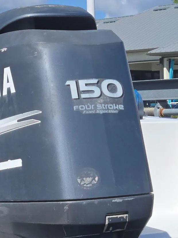 Slide: The Image of Outboard motor on 2008 Sea Hunt Triton 220 boat, 150 horsepower, four-stroke engine. - 23