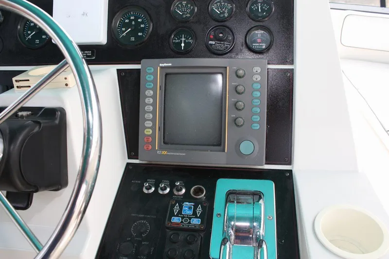 Slide: The Image of Control panel of a 1995 Carver 380 Santego boat with navigation equipment. - 23