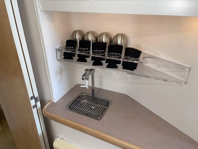 Slide: The Image of 1995 Carver 380 Santego boat interior with beverage holders and faucet. - 42