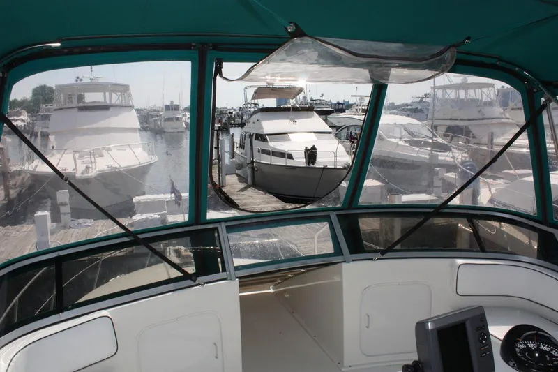 Slide: The Image of Interior view of a 1995 Carver 380 Santego yacht docked at a marina. - 16