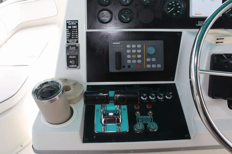 Slide: The Image of 1995 Carver 380 Santego helm with controls, gauges, and cup holder. - 22