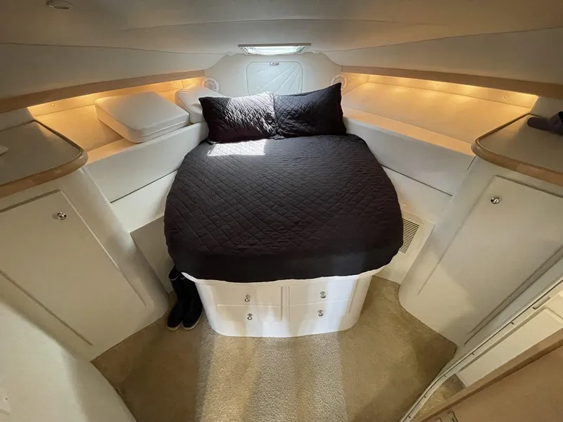 Slide: The Image of 1995 Carver 380 Santego cabin with cozy bed, ambient lighting, and modern design. - 43