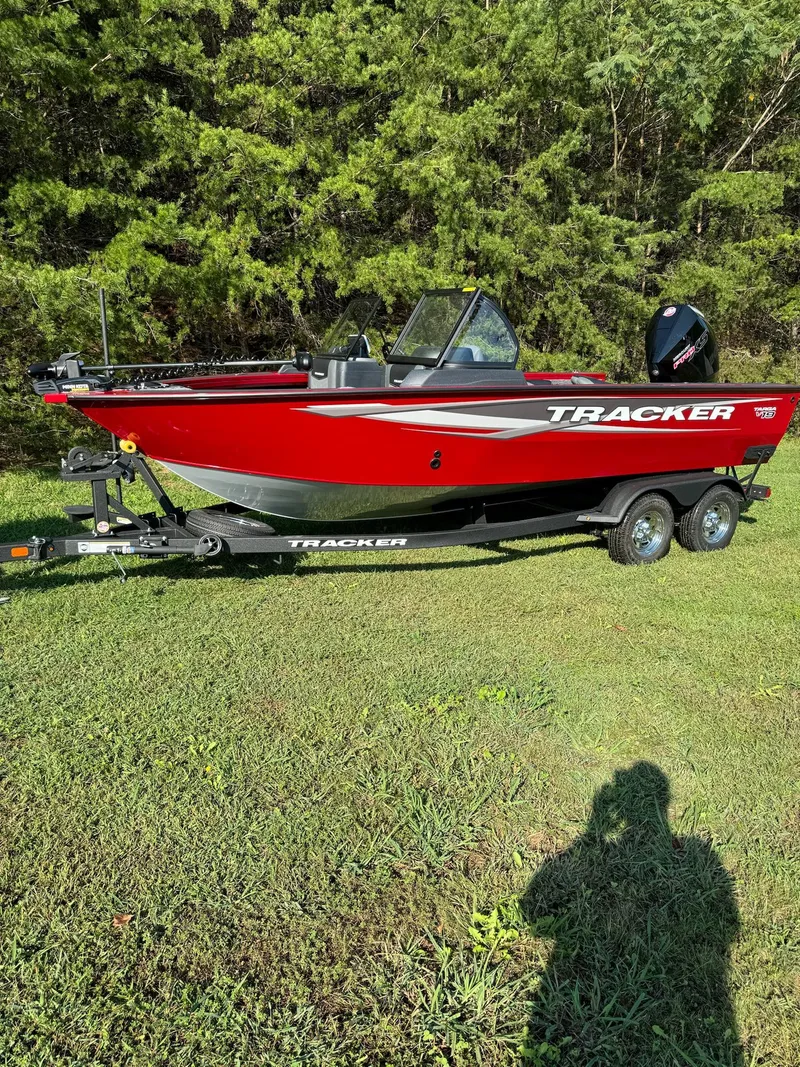 The Image of 2025 Tracker Targa V-19 Combo boat on trailer, parked on grass. - 0