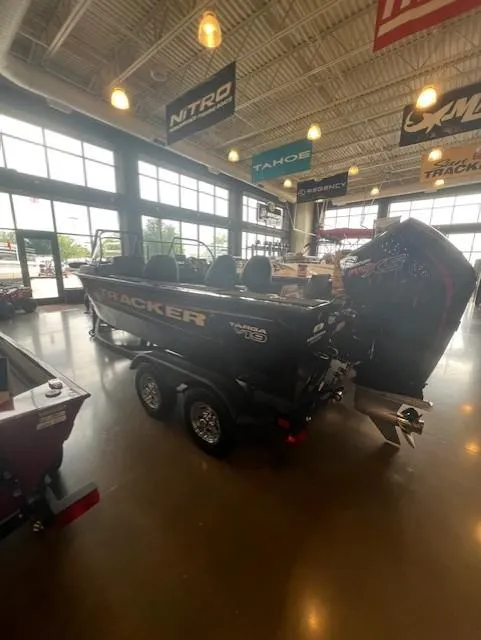 Slide: The Image of 2025 Tracker Targa V-19 Combo boat displayed in a showroom. - 3