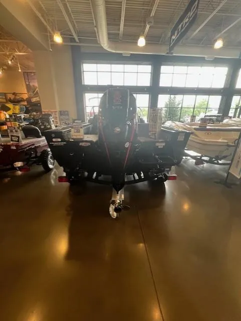 Slide: The Image of 2025 Tracker Targa V-19 Combo boat displayed in a showroom. - 4