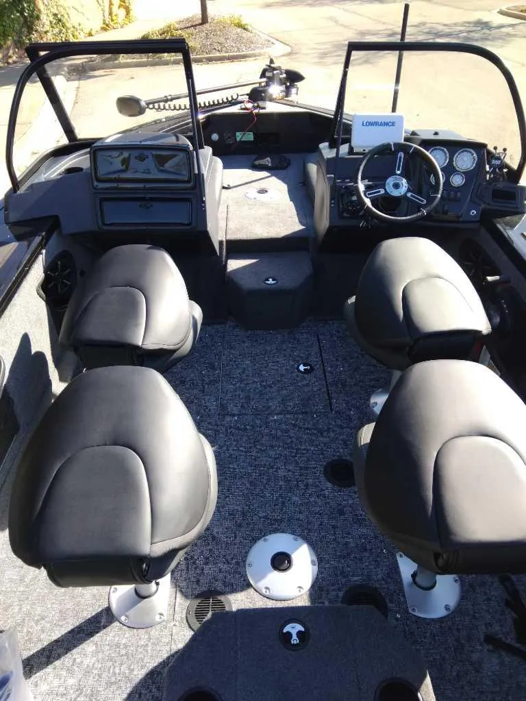 Slide: The Image of 2025 Tracker Targa V-18 Combo boat interior with seating and steering console. - 3