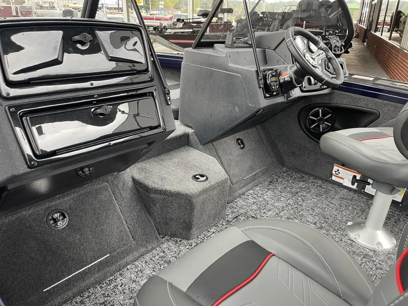Slide: The Image of 2025 Tracker Targa V-18 Combo boat interior with modern dashboard and seating. - 13