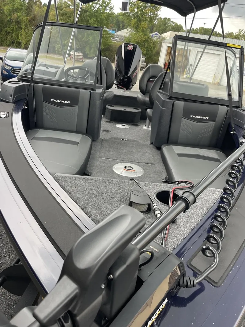 Slide: The Image of 2025 Tracker Targa V-18 Combo boat interior with seating and steering console. - 4
