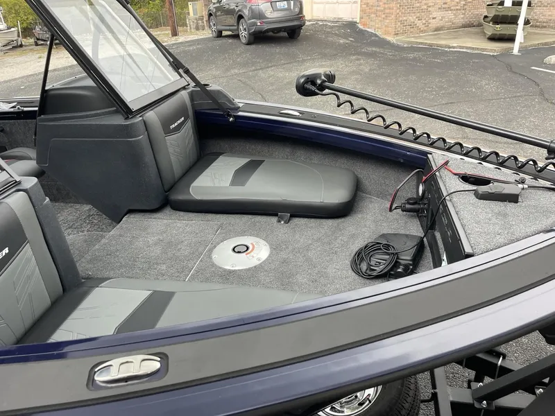 Slide: The Image of 2025 Tracker Targa V-18 Combo boat interior with seating and trolling motor. - 5