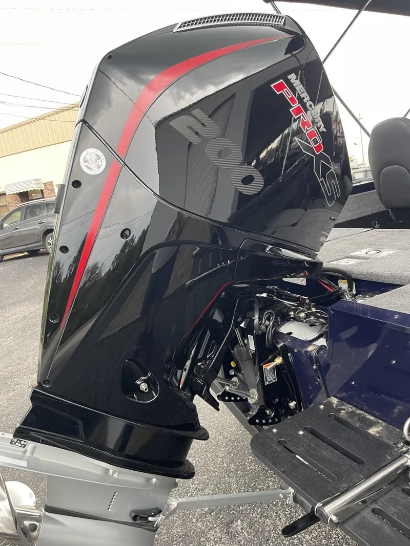 Slide: The Image of 2025 Tracker Targa V-18 Combo boat engine with sleek black and red design. - 9