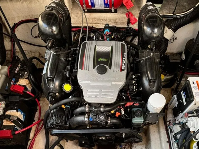 Slide: The Image of Engine compartment of a 2012 Sea Ray 260 Sundancer boat, featuring a 350 MAG engine. - 18