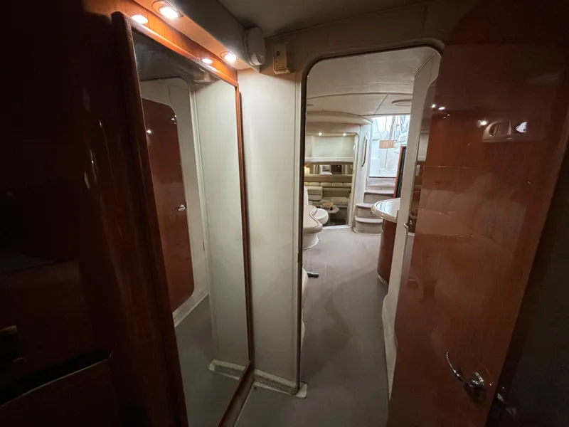 Slide: The Image of Interior of a 1998 Sea Ray 400 Sundancer yacht, featuring a cozy cabin space. - 21