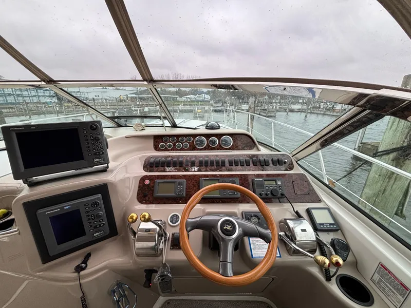 Slide: The Image of Cockpit view of a 1998 Sea Ray 400 Sundancer yacht with navigation equipment. - 9