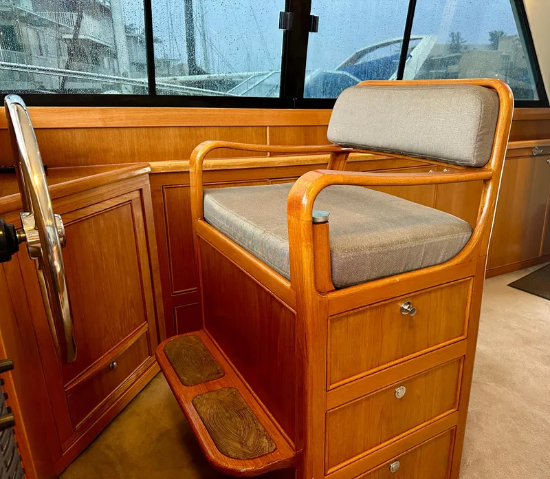 Slide: The Image of Wooden helm seat in 1998 Riviera 43 yacht interior. - 22