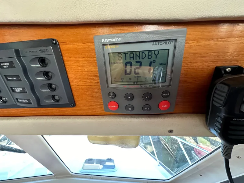 Slide: The Image of Autopilot control panel on 1998 Riviera 43 boat dashboard, displaying "Standby" mode. - 34