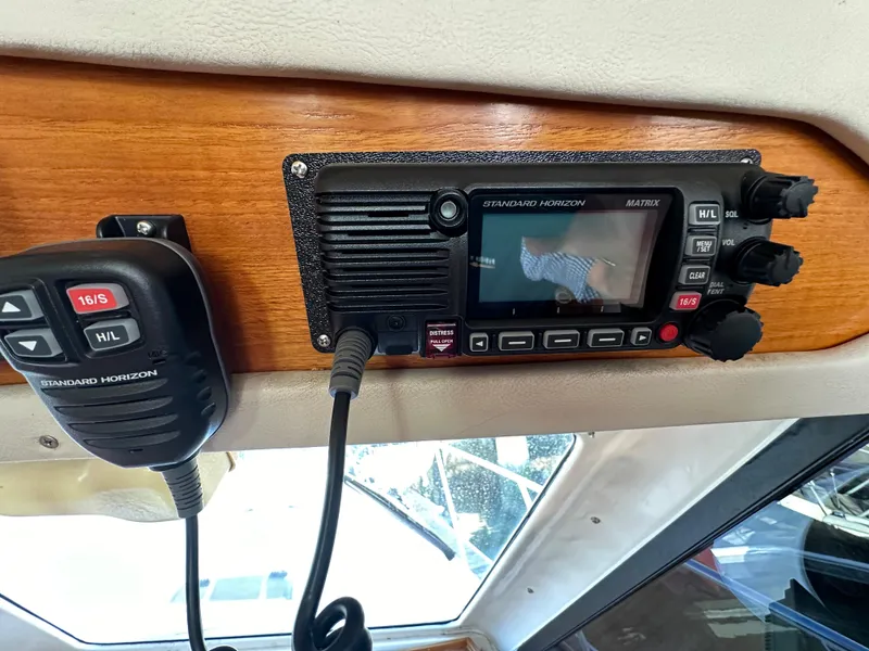 Slide: The Image of Standard Horizon marine radio on 1998 Riviera 43 boat dashboard. - 40