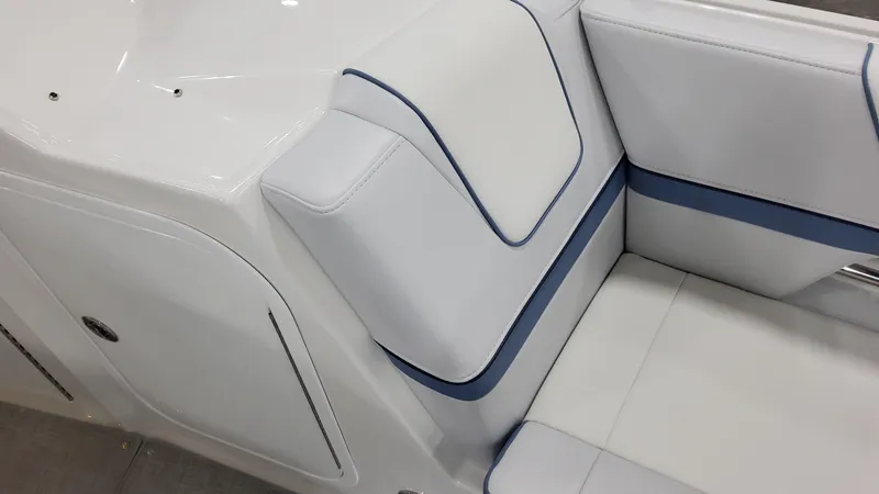 Slide: The Image of 2025 Formula 330 Crossover Bowrider OB interior seating with white and blue upholstery. - 11