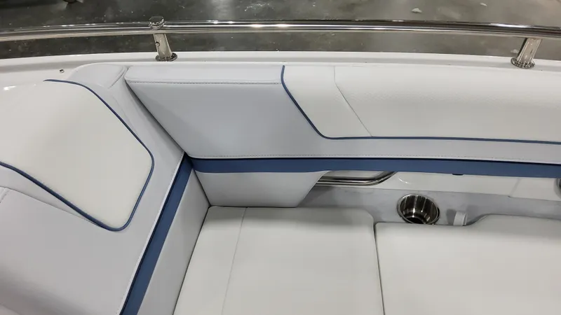 Slide: The Image of 2025 Formula 330 Crossover Bowrider OB interior seating with white and blue upholstery. - 12