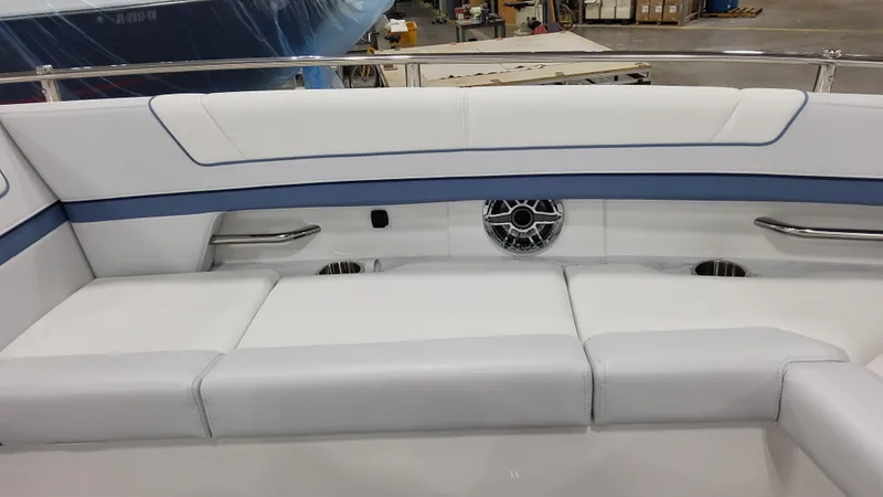 Slide: The Image of 2025 Formula 330 Crossover Bowrider OB interior seating with sleek white and blue upholstery. - 13