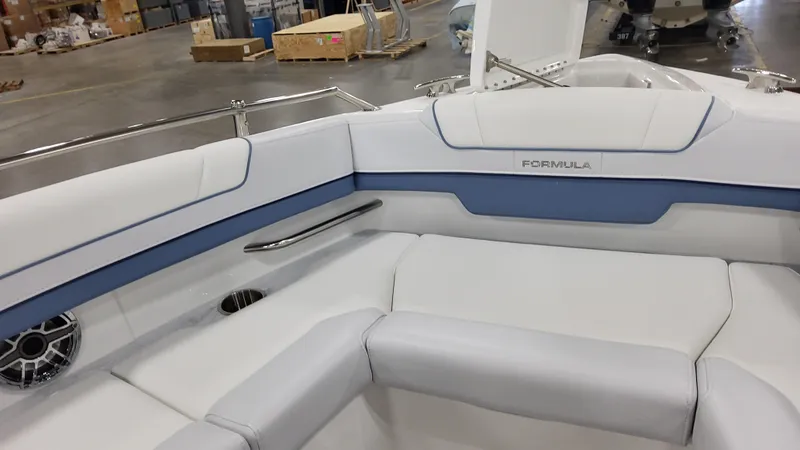 Slide: The Image of 2025 Formula 330 Crossover Bowrider OB interior with white and blue seating. - 14