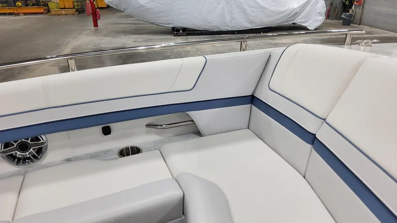 Slide: The Image of 2025 Formula 330 Crossover Bowrider OB interior with white and blue seating. - 17
