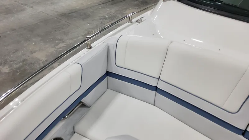 Slide: The Image of 2025 Formula 330 Crossover Bowrider OB interior with white and blue seating. - 18