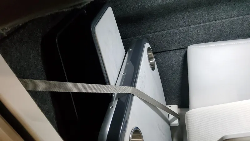 Slide: The Image of 2025 Formula 330 Crossover Bowrider OB interior storage with secured table. - 21