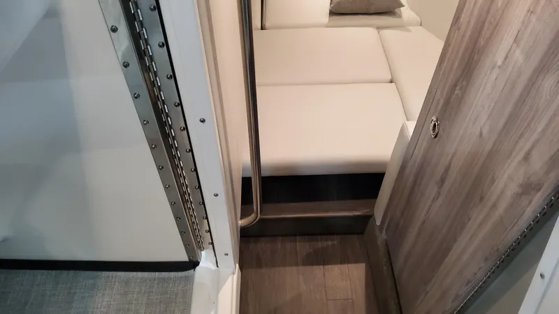 Slide: The Image of Interior view of 2025 Formula 330 Crossover Bowrider OB, featuring sleek seating and modern design. - 25