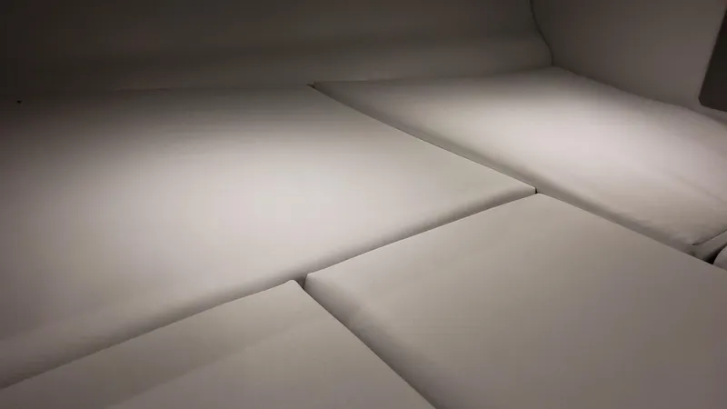 Slide: The Image of Interior seating of 2025 Formula 330 Crossover Bowrider OB, featuring sleek, cushioned design. - 27