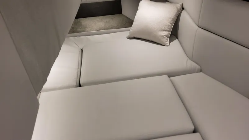 Slide: The Image of 2025 Formula 330 Crossover Bowrider OB interior with plush seating and cushion. - 28